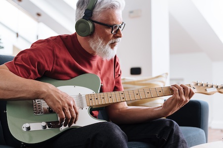 older man learning blues lead guitar